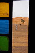 Berber Man Walking On Desert