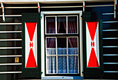 Colorful House With Window Shutters