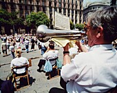 Man Playing Trumpet In Front Of Barcelona Cathedral