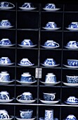 Porcelain Tea Sets In Display Cabinet