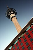 Sky Tower Placed Behind Modern Red Building