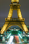 Traffic On Champs D'elysees Under Eiffel Tower At Night, Paris,France