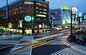 Early Evening At Busy Intersection Sukiyabashi Crossing In The Popular Shopping Ginza Area Tokyo,Japan