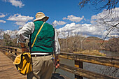 Hiker On Bridge In Red Rock State Park,Rear View, Arizona,Usa