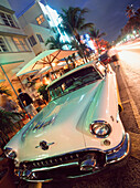 Old American Car Parked Outside Cafes And Hotels On Ocean Drive,South Beach,Miami,Florida,Usa.