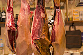 Spanish Ham Hung In A Shop In Boqueria Market, One Of The Most Famous Markets Around Spain And The Most Famous In Barcelona; Barcelona, Catalonia, Spain
