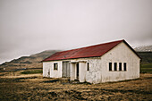 Weathered Building Under Clouds On The Snaefellsnes Peninsula; Iceland