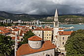Buildings and a church tower in the coastal town of Budva; Budva, Opstina Budva, Montenegro