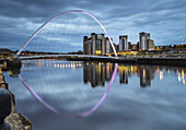 Gateshead Millennium Bridge and reflection in the River Tyne; Gateshead, Tyne and Wear, England
