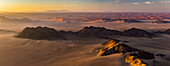 Aerial view of the sand dunes of the Namib Desert at sunrise; Sossusvlei, Hardap Region, Namibia