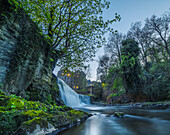 Edinburgh waterfall surrounded by medieval buildings; Edinburgh, Scotland