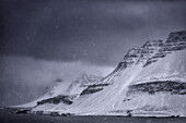 A snow storm along the Strandir Coast on Iceland's West Fjords; Iceland