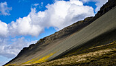 Strong erosion creates dramatic scree slopes on what was once active volcanoes in central Iceland; Borgarnes, Iceland