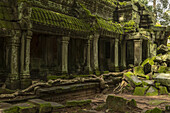 Colonnade with mossy roof by fallen rocks, Angkor Wat; Siem Reap, Siem Reap Province, Cambodia