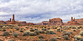 Jogger in the Valley of Gods with rock formations, panorama of stitched images; Utah, United States of America