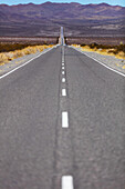 Road going through the arid and mountainous landscape of Los Cardones National Park; Salta Province, Argentina