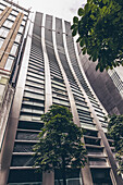 Unique architecture with a curving wall on a front facade of a building; Tokyo, Kanto, Japan