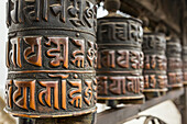 Buddhist prayer wheels at the Swayambhunath Monkey Temple in Kathmandu; Kathmandu Valley, Nepal