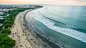 Aerial view of the crowds on Kuta Beach and the waves of the Indian Ocean; Kuta, Bali, Indonesia