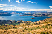 Scenic overview of Lake Wanaka from Roys Peak, a strenuous hike with spectacular views; Wanaka, Otago, New Zealand