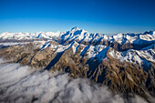 A helicopter tour provides stunning views over the Mount Cook glacier and surrounding mountaintops, Mount Cook National Park; Canterbury, New Zealand