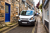 Driving down the narrow streets of St. Ives, a small fishing village on the South Western tip of Cornwall, England; Saint Ives, Cornwall, England