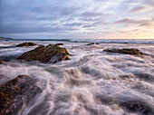 Long exposure of waves along the California coast; Irvine, California, United States of America