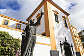 Statue of a religious figure holding a cross in front of the Main Church of Praia da Vitoria; Terceira, Azores