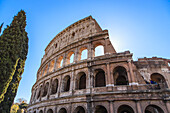 Close-up view of the iconic Colosseum against a blue sky; Rome, Lazio, Italy