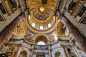 Magnificent interior of Sant'Agnese In Agone Catholic church with gilded arched windows and ornate domed ceiling; Rome Lazio, Italy