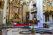 Interior of Sant'Agnese showing the main altar with ornate, gilded moldings and relief carvings and fine art frescos; Rome Lazio, Italy
