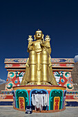 Giant gold plated statue of a seated Buddha at Likir Monastery above the Indus Valley, in the Himalayan Mountains, Jammu and Kashmir; Likir, Ladakh, India