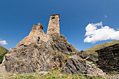 Stone tower ruins of Sno Castle, built on top of a rocky cliff in the village of Sno in the Kazbegi District; Sno, Kazbegi, Georgia
