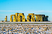Close-up of Stonehenge defined by early morning snow; Wiltshire, England, United Kingdom