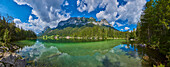 Lake Hintersee with the mirror reflection of the peaks of the Bavarian Alps; Berchtesgadener Land, Ramsau, Bavaria, Germany