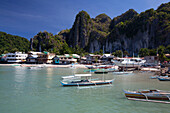Bangka Boats Sit In The Picturesque And Scenic Bay; El Nido, Bacuit Archipelago, Palawan, Philippines