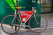 Bicycle Parked In Street Advertising Bike Rentals; Malaga Malaga Province Spain