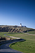 Sumburgh Head Lighthouse And A Winding Road; Shetland Scotland