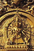 Nepal, Durbar Square; Bhaktapur, Golden Gate, Detail of figure in carving with many heads and arms