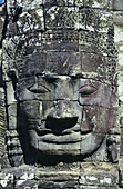 Cambodia, Siem Reap, Angkor Thom, Close-up of carved stone face of Jayavarman VII; Bayon