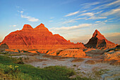 A Red Sunrise Illuminates The Hills In Badlands National Park; Dakota United States Of America