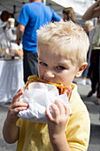 Young Boy Eating Pastry; Ladner British Columbia Canada