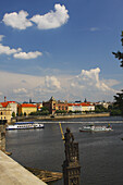 View Of Boats On The Vltava River From Charles Bridge Or Karluv Most; Prague Czech Republic