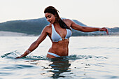Woman In A Bikini Wades In The Water; Tarifa Cadiz Andalusia Spain