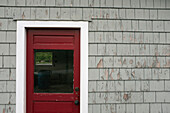 Red Door and Weathered Gray Wall