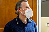 Man wearing Protective Face Mask, head and shoulders Profile