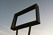 Low Angle View of Old Metal Sign Frame with No Message against dusky Sky