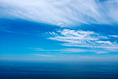 Clouds and blue sky over the Pacific Ocean