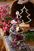 Tiered dessert stand with flower mix in blue and violet