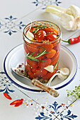 Simple cherry tomatoes pickled with rosemary and garlic